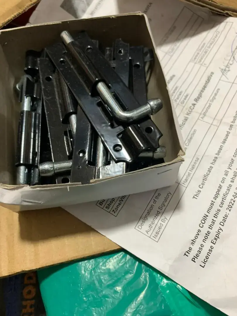 A box of black door bolts