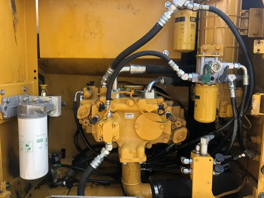 Hydraulic pump and filters inside an excavator