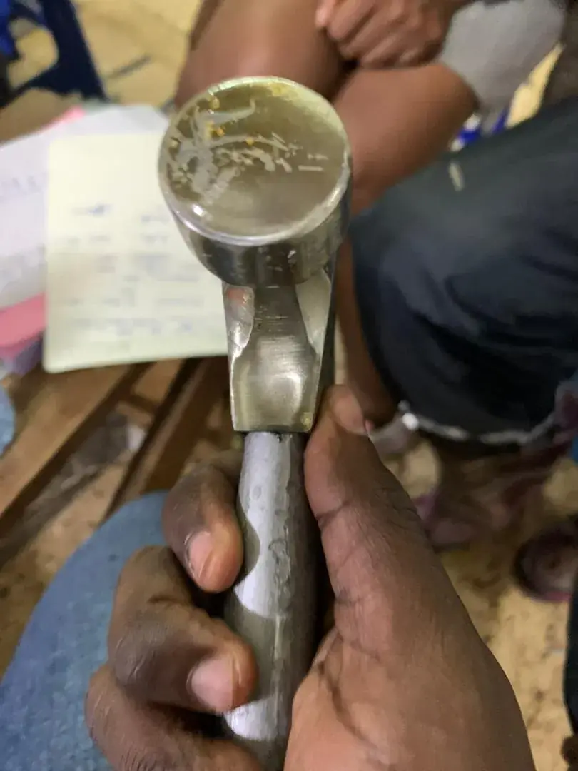 A claw hammer held in hand