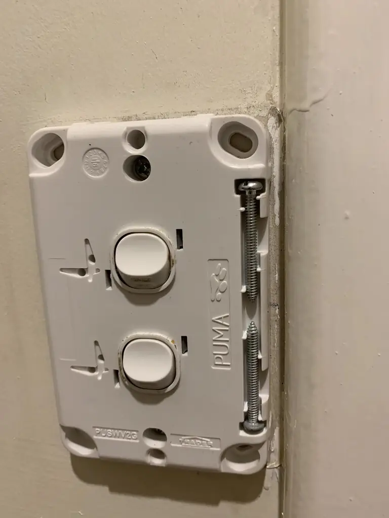 A double light switch fitting